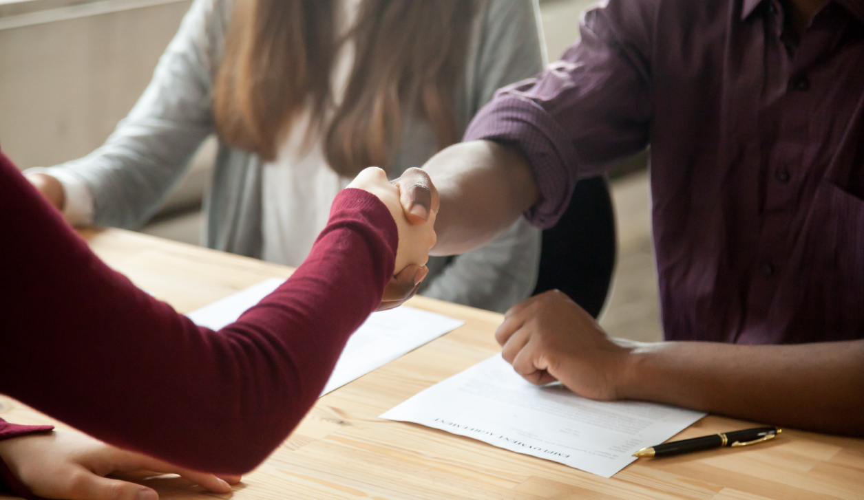 Close up of two people shaking hands